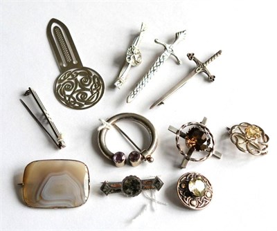 Lot 160 - A Scottish amethyst set plaid pin, three citrine set brooches, six other Scottish brooches and...