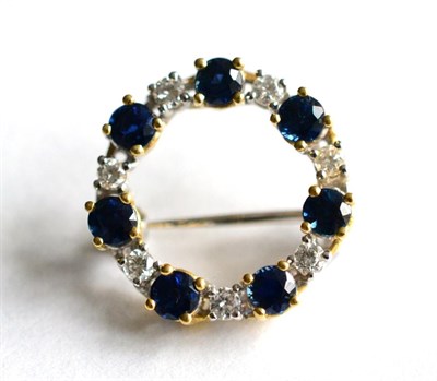 Lot 166 - An 18 carat gold sapphire and diamond brooch, total estimated diamond weight 0.35 carat...