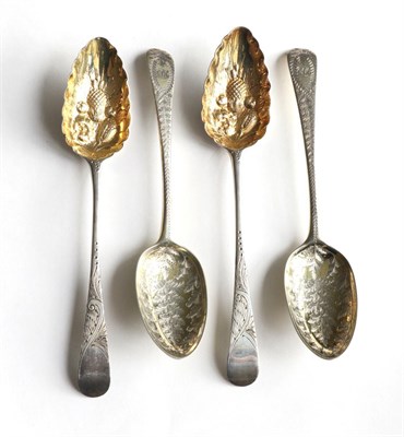 Lot 181 - Two pairs of 18th century silver tablespoons, later decorated and gilt as berry spoons, 8.2ozt