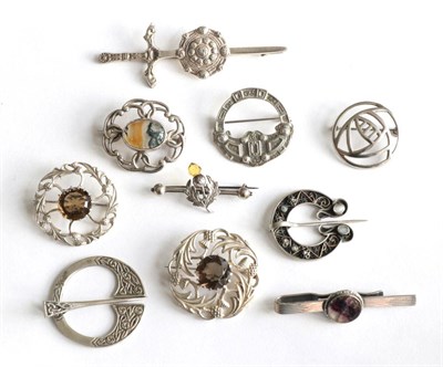 Lot 189 - Two Scottish silver citrine set brooches, a moss agate brooch, six other Scottish brooches and...