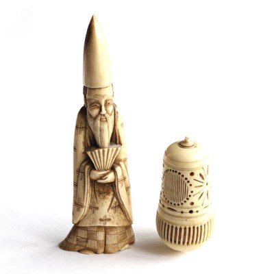 Lot 192 - A 19th century ivory figure of a bearded Oriental man; and a 19th century pierced bone acorn...