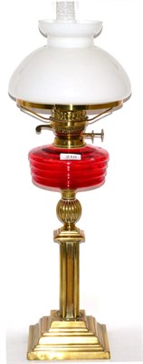 Lot 210 - Brass oil lamp with ruby reservoir