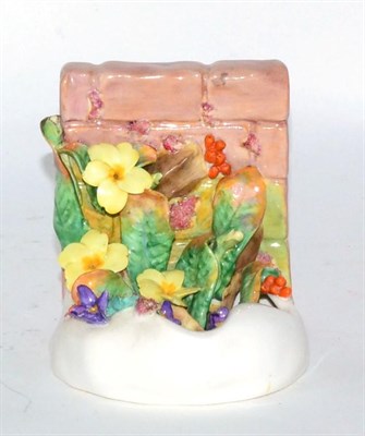 Lot 214 - A Royal Doulton floral bookend of naturalistic from, mark to base