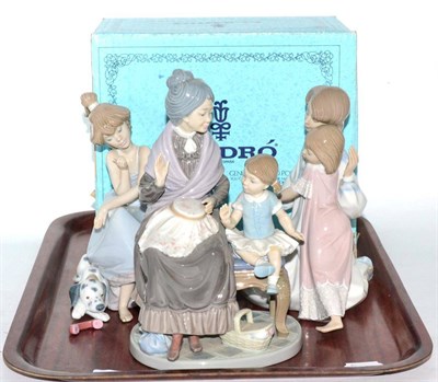 Lot 235 - Three Lladro figure groups, mother and daughter, child and grandmother, and girl with dalmation