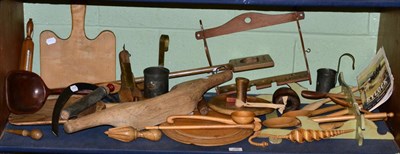 Lot 250 - A group of 19th century kitchenalia including bread paddles and boards, measures, dairy yoke,...