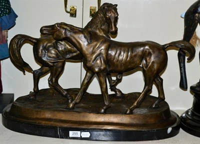 Lot 255 - A large bronze group of two horses, marble base