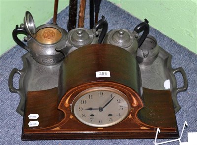 Lot 258 - An Art Deco inlaid mahogany mantel clock and a Roundhead hammered pewter six piece tea/coffee set