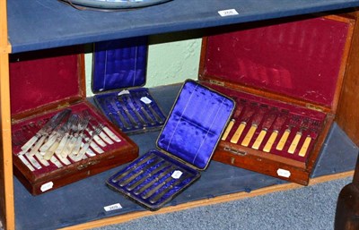 Lot 269 - A cased set of twelve electroplated fish knives and forks; a set of twelve cased fruit knives...