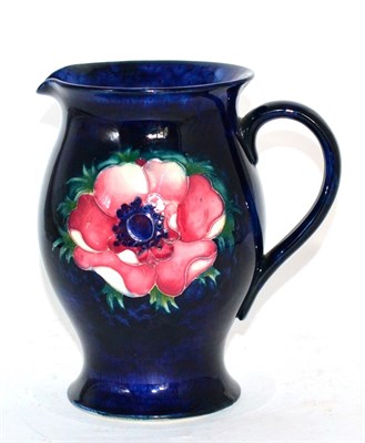 Lot 273 - A Moorcroft jug in anemone pattern, with painted and impressed signatures to the base