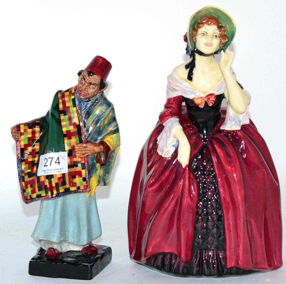 Lot 274 - Two Royal Doulton figures ";Carpet Seller"; and ";Margery"; (2) (a.f.)