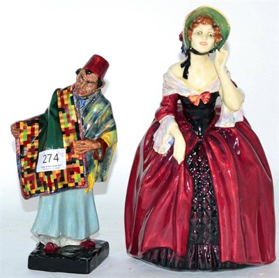 Lot 274 - Two Royal Doulton figures ";Carpet Seller"; and ";Margery"; (2) (a.f.)