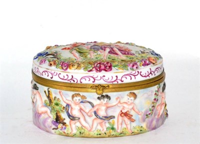 Lot 280 - A Capodimonte style oval casket, relief decoration, gilt mounts