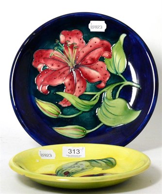 Lot 313 - Two Moorcroft pottery lily pattern plates (one with small chip to reverse)