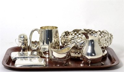 Lot 318 - A small group of silver comprising A Victorian cream jug, a Christening mug, a cream jug, two...