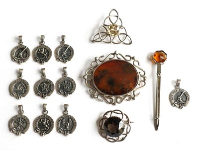 Lot 340 - A large Scottish agate brooch, two citrine set brooches, a dirk pin and ten clan pendants