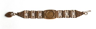 Lot 355 - A 9 carat gold gate link bracelet with a central frame containing a Victorian 1892 half...