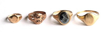 Lot 360 - A 9 carat gold hematite signet ring and three other rings (4)