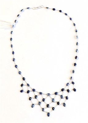 Lot 365 - A sapphire fringe necklace, stamped '585'