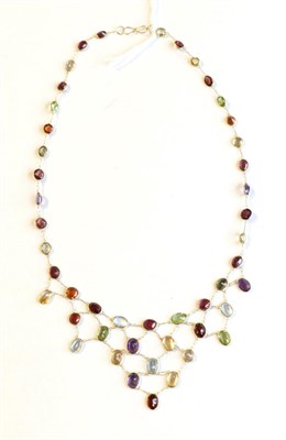 Lot 366 - A multi gemstone fringe necklace, stamped '585'