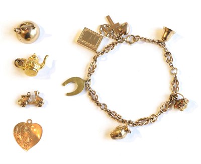 Lot 367 - A charm bracelet and loose charms