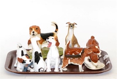 Lot 390 - Royal Doulton hounds, Beswick hounds and a model of a whippet (8)