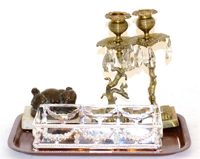 Lot 393 - Two brass candlesticks with drops, signed Pig model and silver plated bottle coaster