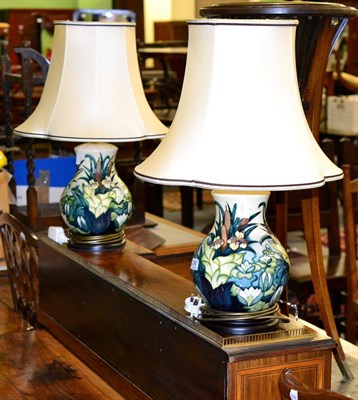 Lot 396 - A pair of Moorcroft pottery table lamps, Bullrush pattern by Rachel Bishop, with silk shades,...