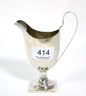 Lot 414 - George III silver helmet shaped cream jug