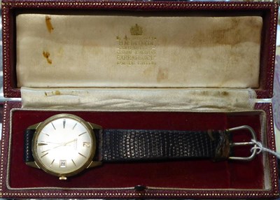 Lot 425 - A gent's 9 carat gold Garrard watch with original box