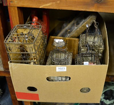 Lot 1023 - A group of five modern Chinese cricket cages, a resin Tang style rocking horse, a game board on...