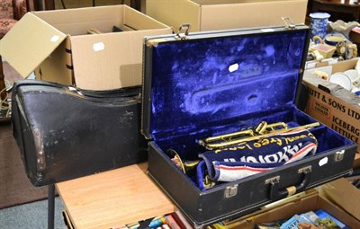 Lot 1028 - A trombone and trumpet with a few accessories (both cased)