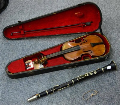 Lot 1037 - Three quarter size German violin with bow, in case, and a clarinet