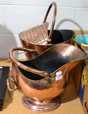 Lot 1057 - Two copper coal helmets