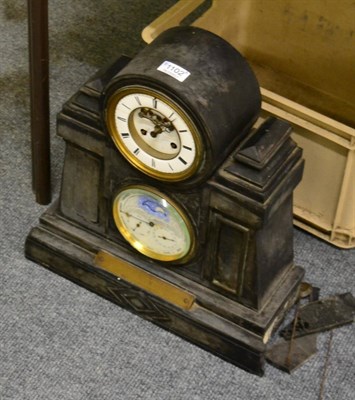 Lot 1102 - A Victorian black slate striking triple calendar presentation mantel clock with moon face...