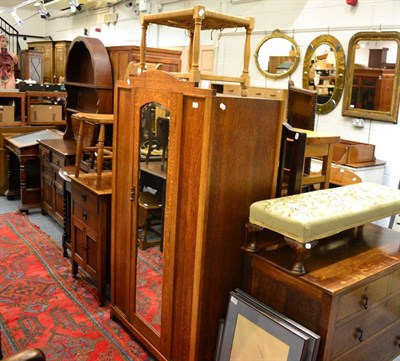 Lot 1149 - A group of early 20th century oak furniture comprising two chests of drawers, a mirrored...