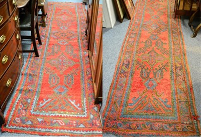 Lot 1156 - A pair of Ushak runners, West Anatolia, the terracotta field with a row of medallions framed by...