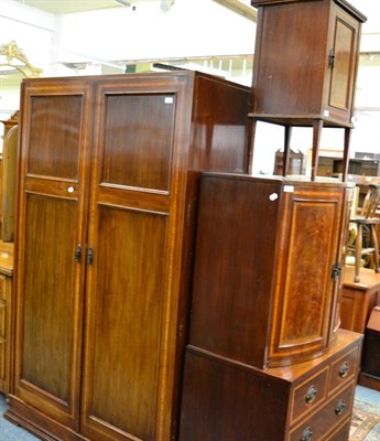 Lot 1160 - An inlaid mahogany double wardrobe, a matching cabinet with bow fronted upper section and three...