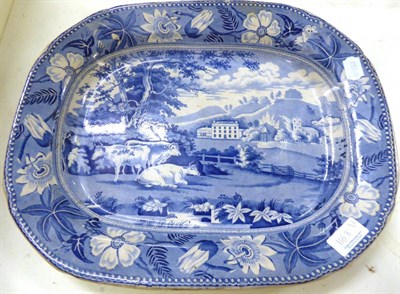 Lot 1168 - A 19th blue and white meat plate depicting cattle resting in front of Wiseton Hall, Notts,...