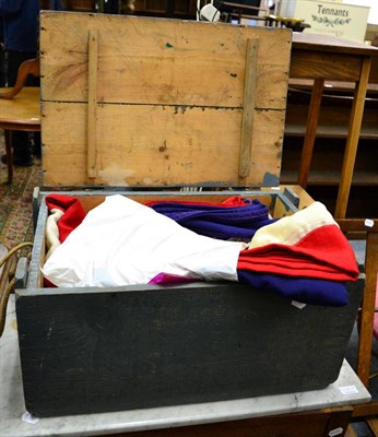 Lot 1173 - A painted wooden trunk containing two Union Jacks, etc