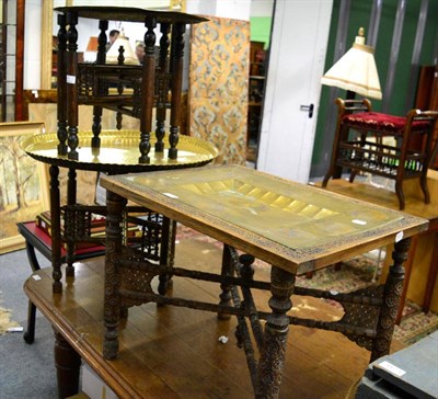 Lot 1174 - A group of three Middle Eastern folding brass topped tray tables (3)