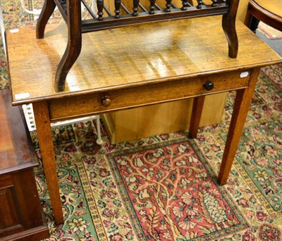 Lot 1177 - An oak side table fitted with a drawer