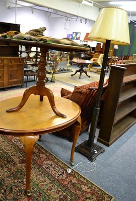 Lot 1181 - An oval breakfast table and a standard lamp