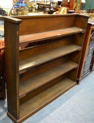 Lot 1182 - An early 20th century oak open bookcase