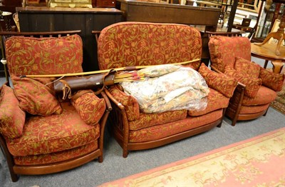 Lot 1186 - An Ercol three piece suite, with additional covers