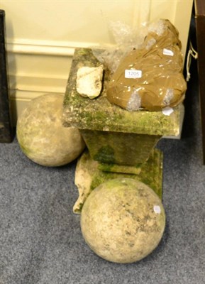 Lot 1205 - Two stone ball finials and a weathered sandstone plinth (a.f.)