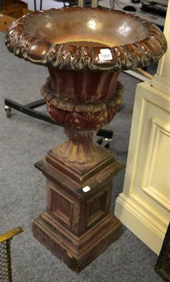 Lot 1207 - A tin glazed terracotta garden urn, raised upon a square formed base&nbsp