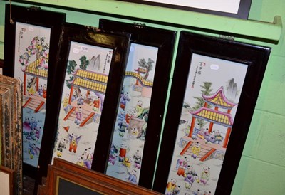 Lot 1256 - A set of four Chinese polychrome porcelain panels decorated with children, each in hard wood frames