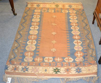 Lot 1319 - Anatolian kilim, the field with five hooked guls enclosed by indigo borders, 170cm by 117cm