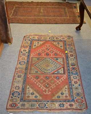 Lot 1320 - Kozak rug, West Anatolia, the brick red field with central pal of hooked medallions framed by...