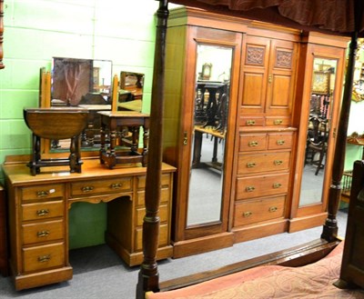 Lot 1331 - An early 20th century two piece bedroom suite comprising a twin mirrored wardrobe and a...